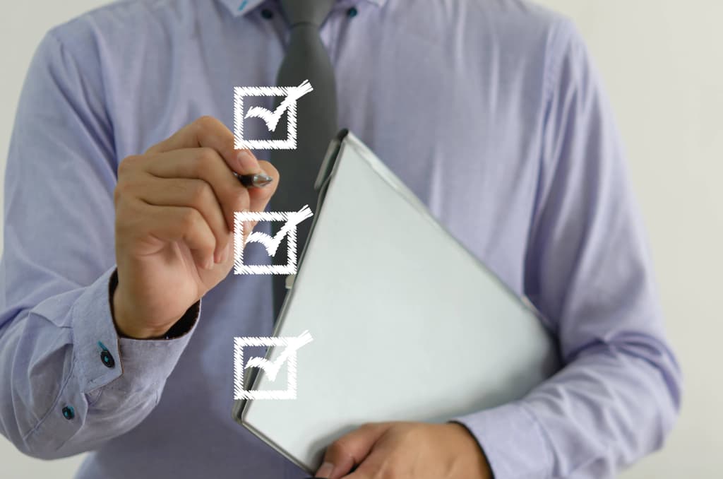 Business man with a checklist image